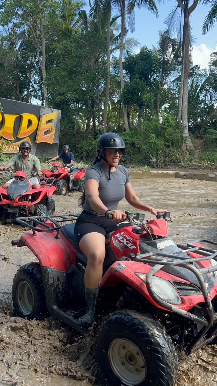 Customer riding a red ATV in Bali